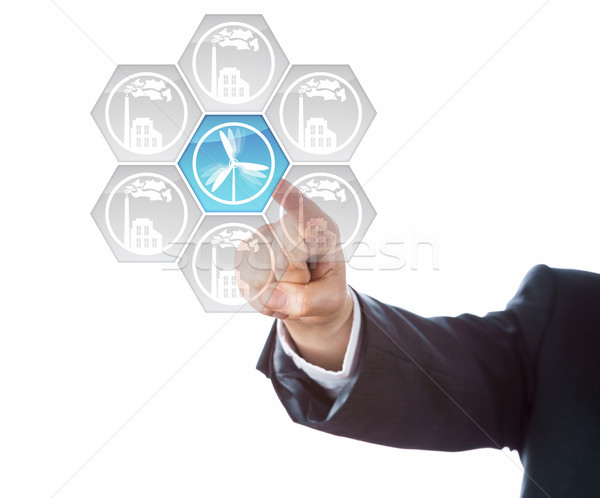 Hand Of Business Man Dialing-In Wind Energy Icon Stock photo © leowolfert