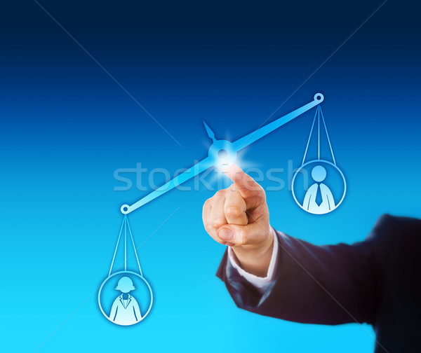 Stock photo: Female Worker Outweighing A Male On Virtual Scale