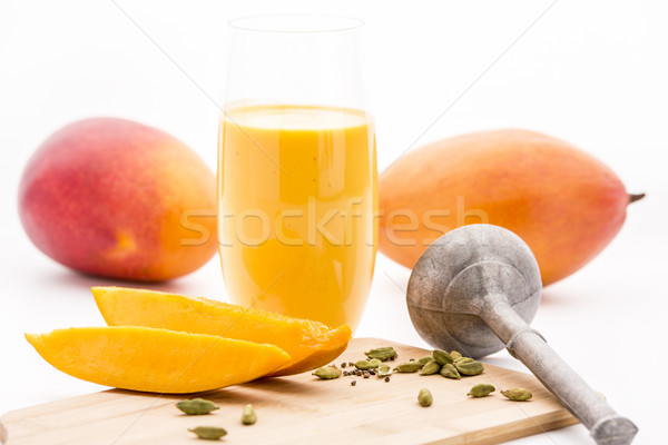 Crushed Cardamon, Pestle, Mangos And Mango Lassie Stock photo © leowolfert