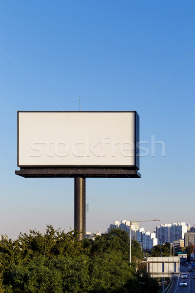 Blank billboard against blue sky Stock photo © leungchopan