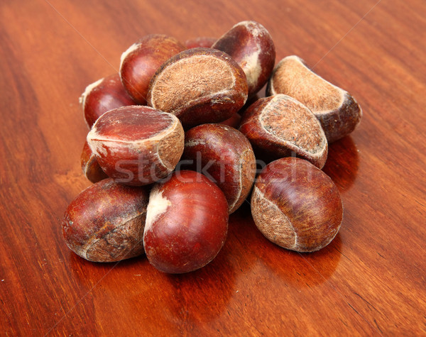 chestnuts on wooden background Stock photo © leungchopan
