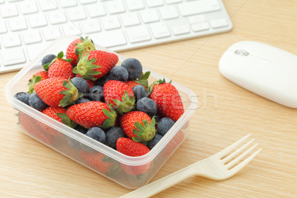 Berry mix lunch box in working desk Stock photo © leungchopan