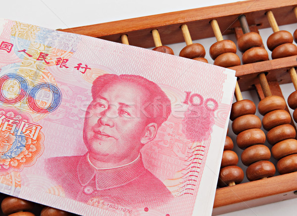abacus and china dollar banknote Stock photo © leungchopan