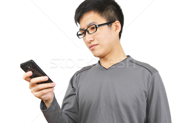 man writting SMS on mobile phone Stock photo © leungchopan