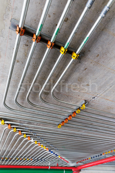 Pipes on wall Stock photo © leungchopan