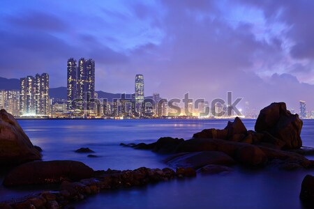 hong kong night scene on rocky coast Stock photo © leungchopan