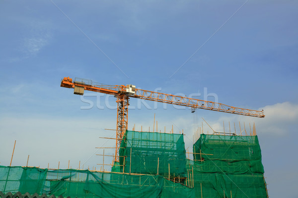 cranes on construction site  Stock photo © leungchopan