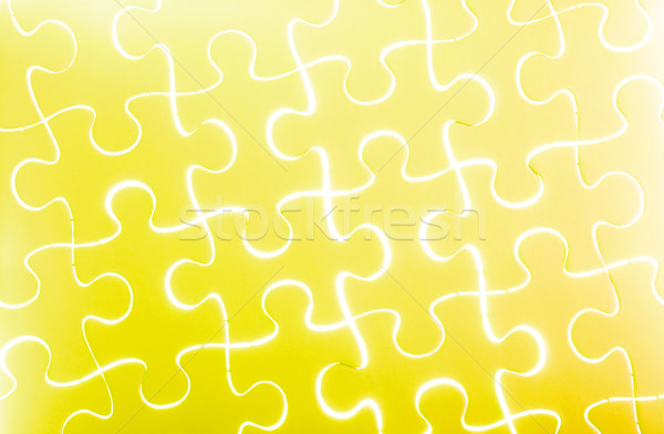 Puzzle in yellow Stock photo © leungchopan
