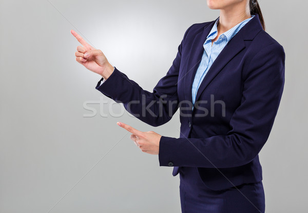 Businesswoman two finger point aside Stock photo © leungchopan