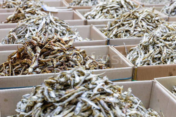 Dried small anchovy fish in the paper box Stock photo © leungchopan