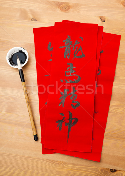 Writing of lunar new year calligraphy, phrase meaning is blessin Stock photo © leungchopan