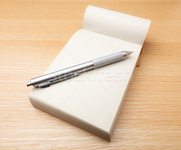 Stock photo: Memo pad and pen on the table