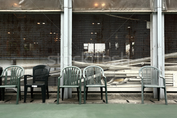 some old chairs in sport court Stock photo © leungchopan