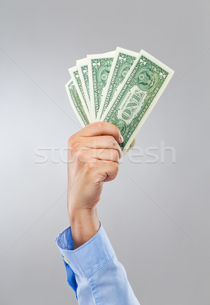 Businessman hand hold group of banknote Stock photo © leungchopan