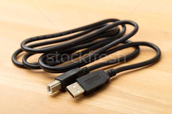 USB cable over the wooden background Stock photo © leungchopan