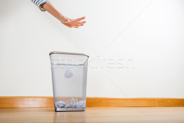 Throwing of paper ball by hand Stock photo © leungchopan