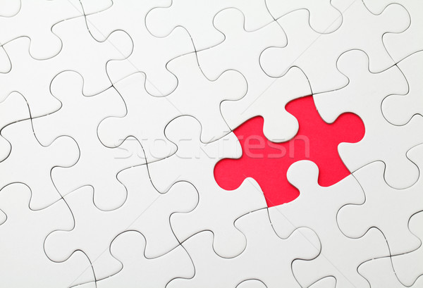 Missing puzzle piece in red color Stock photo © leungchopan