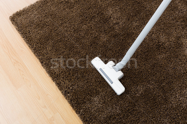 Head of modern vacuum cleaner on carpet  Stock photo © leungchopan