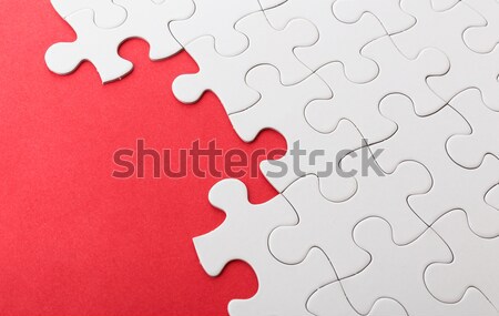 Incomplete puzzle with missing piece over red background Stock photo © leungchopan