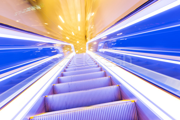 Movement of diminishing hallway escalator Stock photo © leungchopan