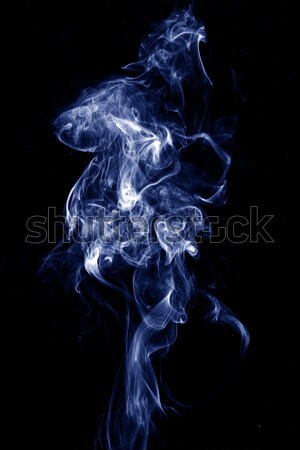 Real blue smoke over black background Stock photo © leungchopan