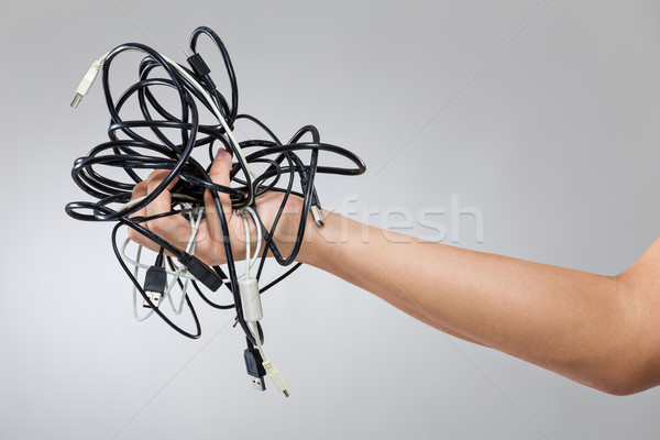 Hand hold with cable wire Stock photo © leungchopan