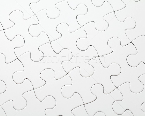 Part of completed white puzzle Stock photo © leungchopan