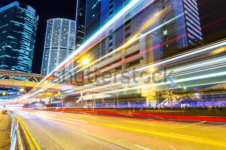 Traffic trail in urban city at night Stock photo © leungchopan