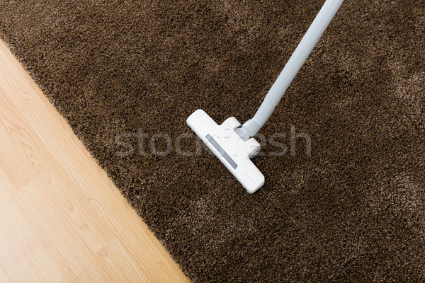 Brown carpet with vacuum cleaner in living room  Stock photo © leungchopan