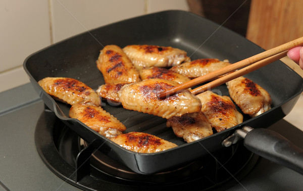 cooking chicken wings Stock photo © leungchopan