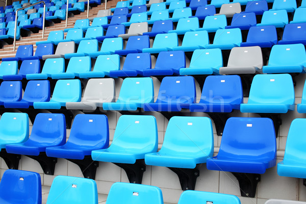 Audiencia asiento estadio deporte azul plástico Foto stock © leungchopan