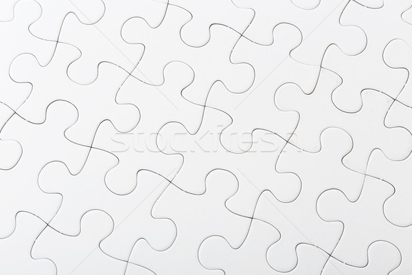 Completed white puzzle Stock photo © leungchopan