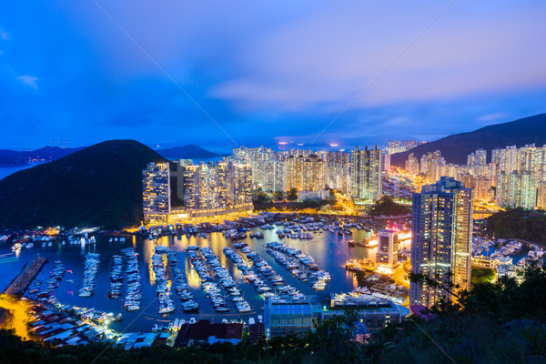 Negócio céu edifício noite barco linha do horizonte Foto stock © leungchopan