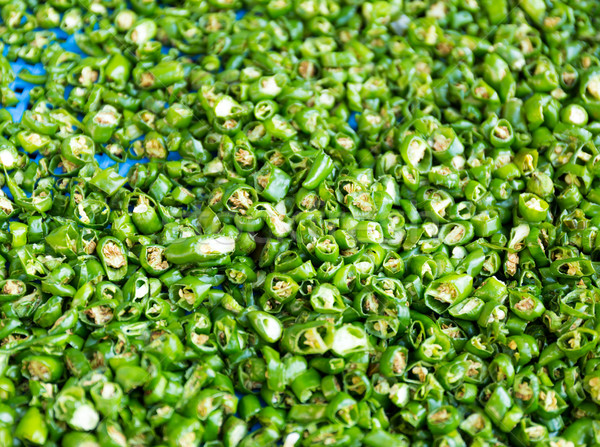 Fresh green chili pepper pieces Stock photo © leungchopan