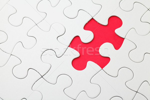 Missing puzzle piece in red  Stock photo © leungchopan
