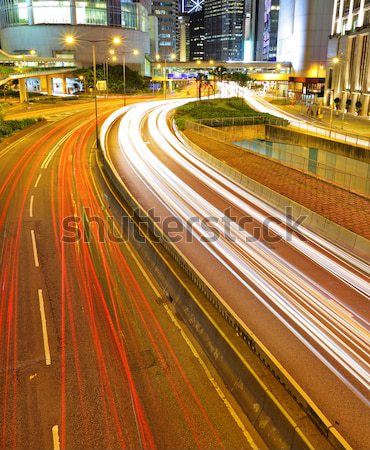 traffic trought downtown at night Stock photo © leungchopan