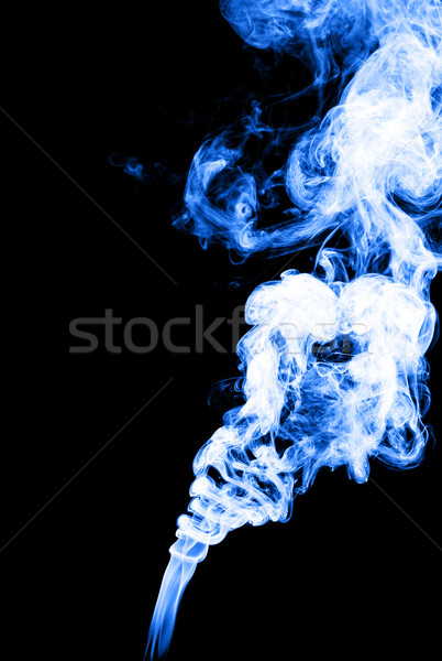 Smoke in blue color on black background Stock photo © leungchopan