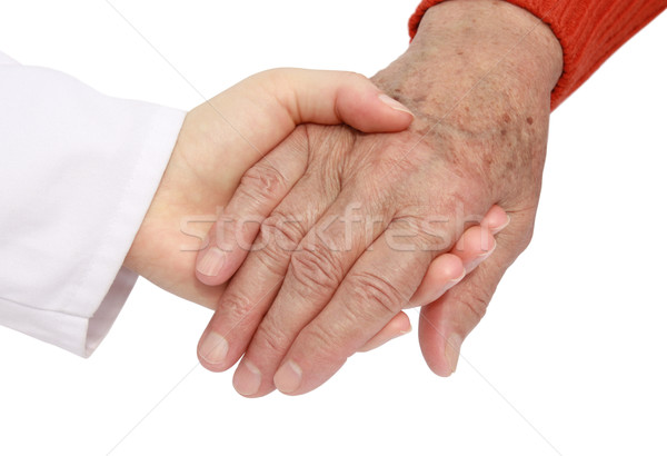 Adult helping senior in hospital Stock photo © leventegyori