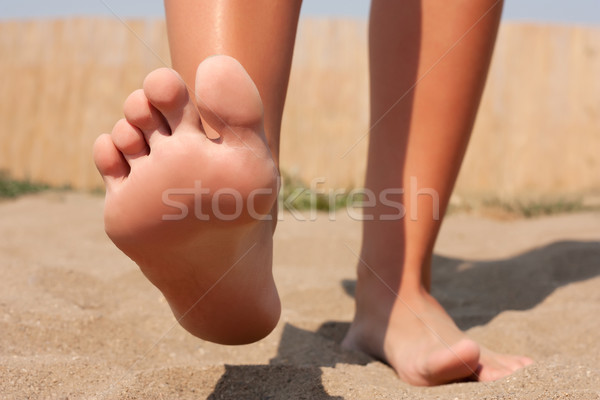 Foot care on beach Stock photo © leventegyori