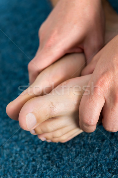 Healthy male feet feeling comfortable at home. Stock photo © leventegyori