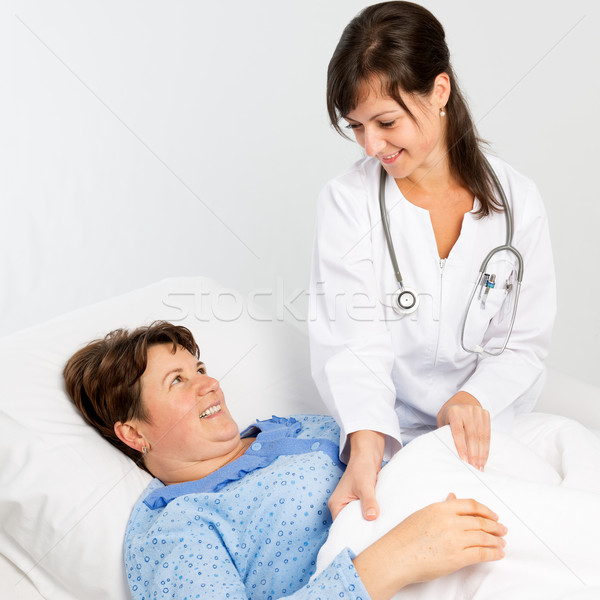 Nurse helping to senior patient Stock photo © leventegyori