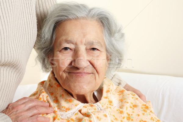 Portrait of a smiling senior woman Stock photo © leventegyori