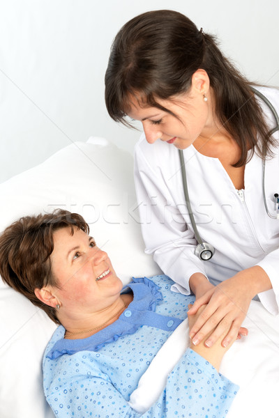 Nurse cares for a elderly woman Stock photo © leventegyori