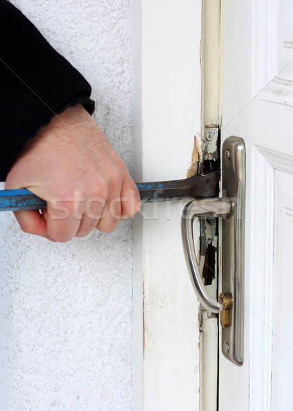 Thief breaking into a house Stock photo © leventegyori