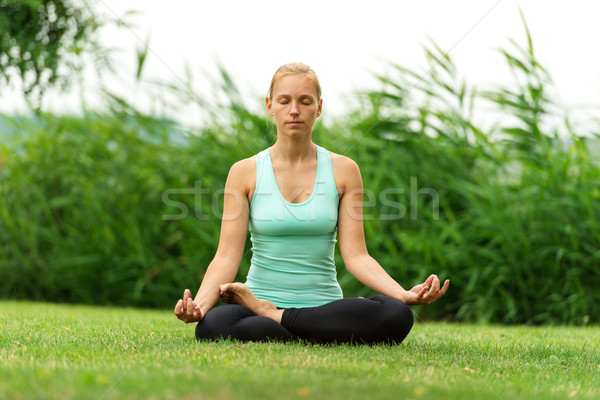 Woman meditating in pose of lotus Stock photo © leventegyori