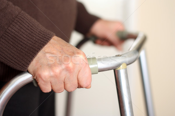 Senior using a walker Stock photo © leventegyori