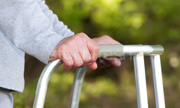 Senior woman using a walker Stock photo © leventegyori