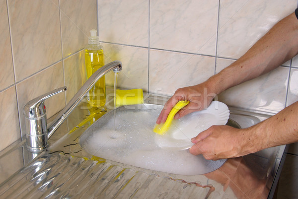 Spăla bucate apă casă mână muncă Imagine de stoc © LianeM