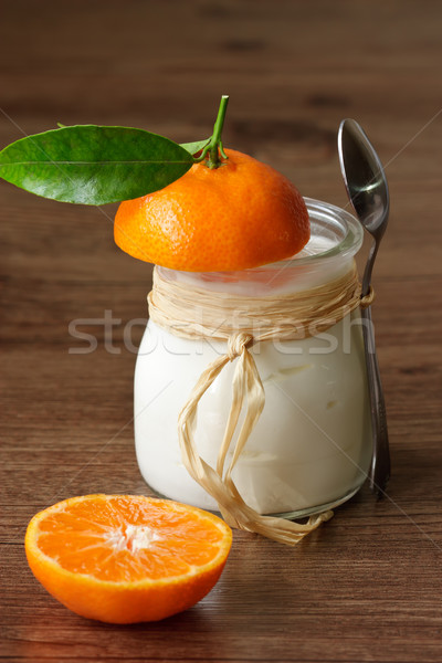 Homemade yoghurt with a mandarine. Stock photo © lidante