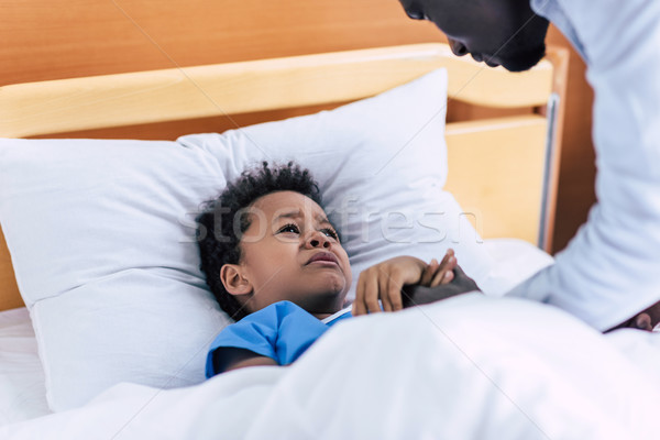 crying african american boy in hospital Stock photo © LightFieldStudios